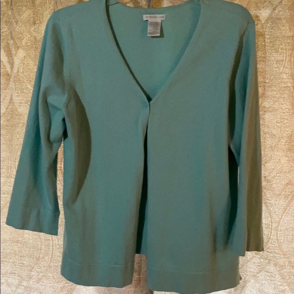 Light blue, aqua colored cardigan.